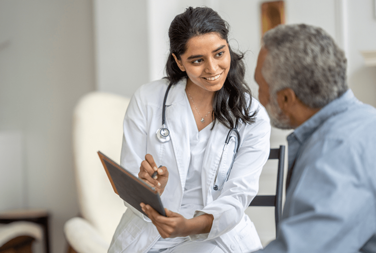 Healthcare professional consulting with a man