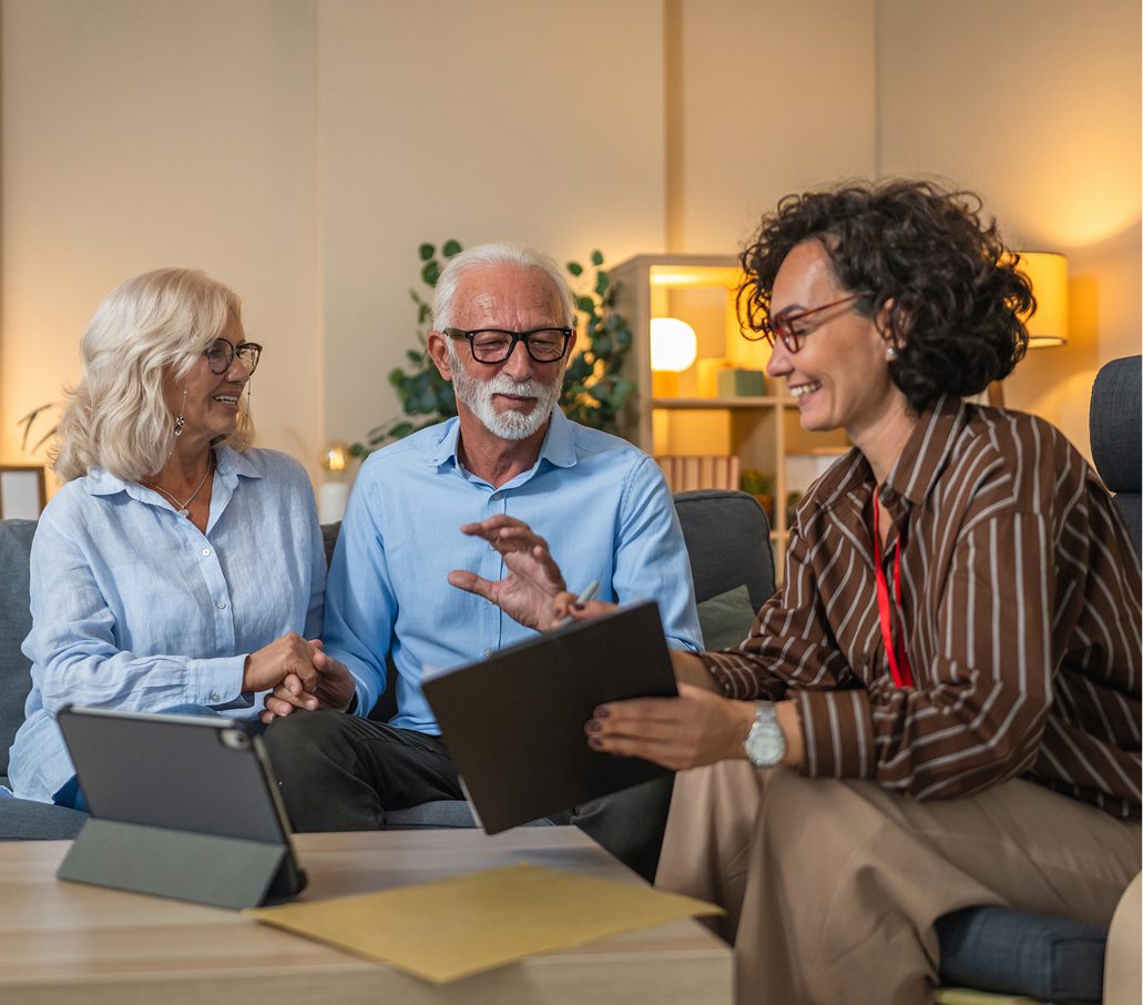 Older couple consulting with a professional advisor.