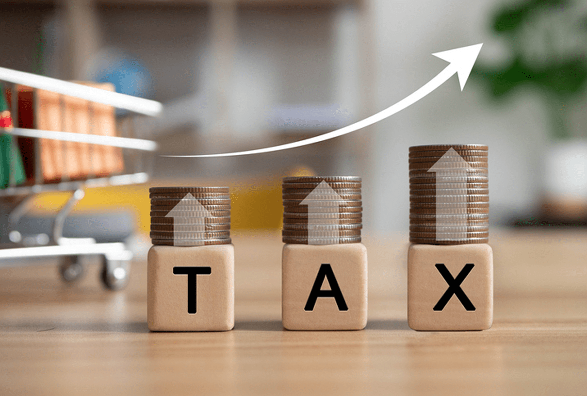 Increasing tax concept with coins and arrow