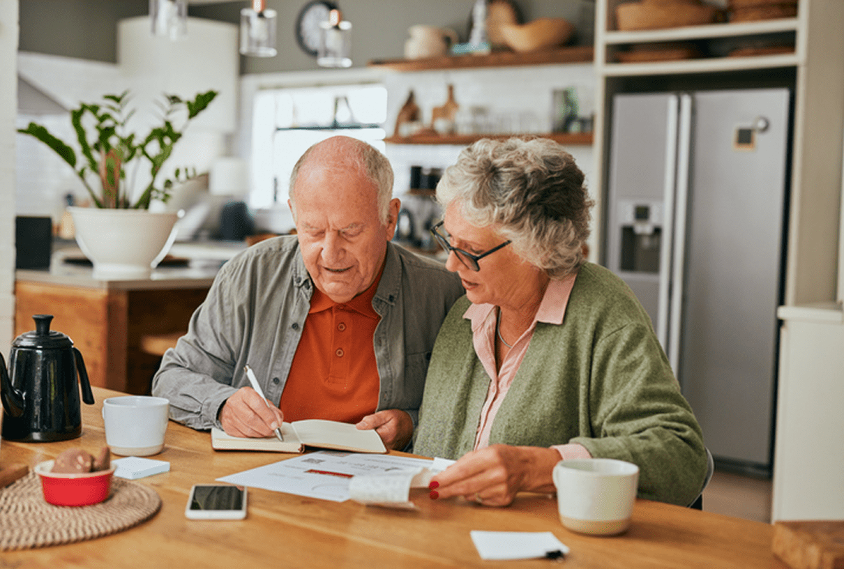 Senior couple reading documents together