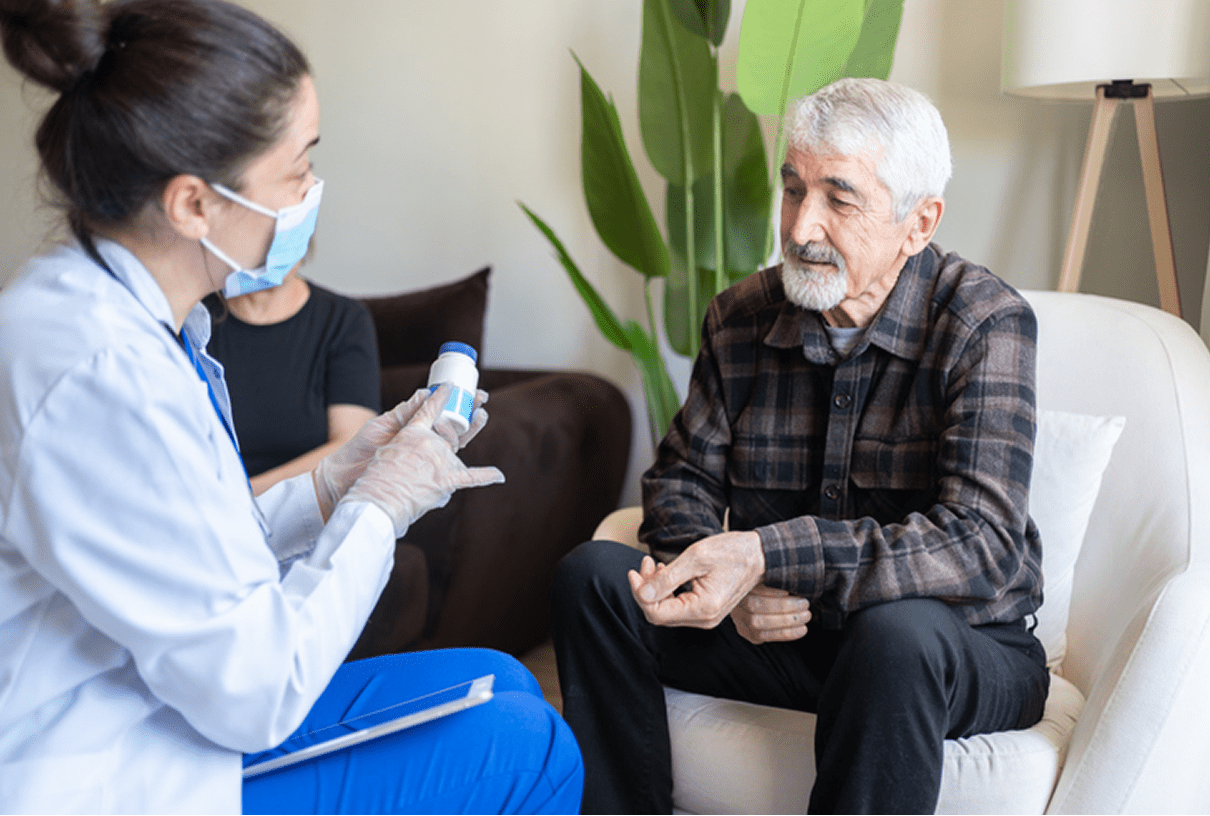 Doctor explaining prescription to senior patient.