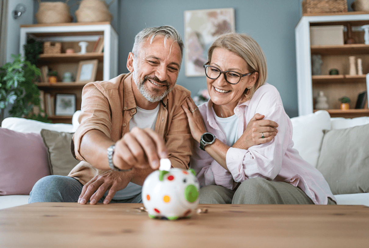 Couple saving money in a piggy bank